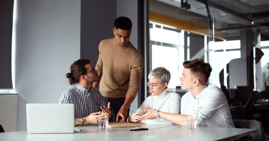 A group of people sitting around a table
AI-generated content may be incorrect.