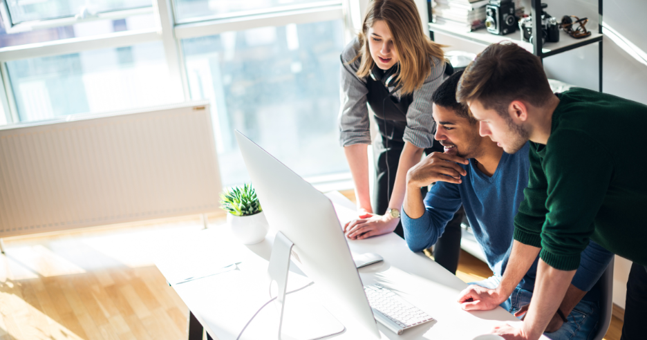 A group of people looking at a computer
AI-generated content may be incorrect.