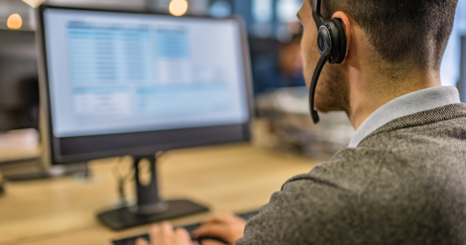 A person wearing a headset and using a computer
AI-generated content may be incorrect.